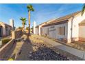 Landscaped walkway to the side of a charming single story home at 1215 Country Club Dr, Laughlin, NV 89029