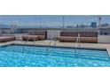 Refreshing rooftop pool with comfortable lounge chairs and stunning city views at 150 N Las Vegas Blvd # 1505, Las Vegas, NV 89101