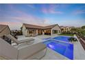 Luxury pool and spa with lounge chairs at 1999 Oliver Springs St, Henderson, NV 89052