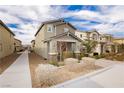 Inviting exterior showcasing well-maintained landscaping and a peaceful suburban street at 2499 Adige Pl, Henderson, NV 89044