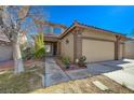 Two-story house with attached three-car garage at 3034 Scenic Valley Way, Henderson, NV 89052