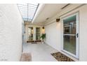 Private outdoor patio with decorative tile flooring and a sunlit, enclosed structure at 3127 S Eastern Ave, Las Vegas, NV 89169