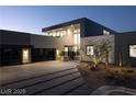 Contemporary home showcasing a modern design, clean lines, and well-manicured landscaping at 4377 Cameron Brook Ct, Las Vegas, NV 89129