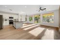 Modern kitchen with island, stainless steel appliances, and hardwood floors at 4379 Bella Cascada St, Las Vegas, NV 89135