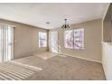 Spacious living room featuring neutral colors and carpet at 51 Belle Ridge Ave, Las Vegas, NV 89123