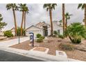 Inviting single-story home with desert landscaping and mature palm trees at 5416 Lochmor Ave, Las Vegas, NV 89130