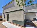 Rear view of the house, showing a private entrance and walkway at 6149 Ethel May Ave, Las Vegas, NV 89108