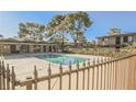 Community swimming pool with surrounding trees at 625 S Royal Crest Cir # 23, Las Vegas, NV 89169