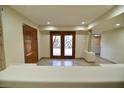 Bright entryway with double doors leading to a patio at 7045 Edna Ave, Las Vegas, NV 89117