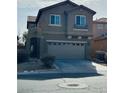 Two-story house with attached garage and landscaping at 9217 Placer Bullion Ave, Las Vegas, NV 89178