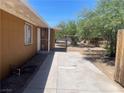 Spacious driveway and side yard with a secure, fenced area for outdoor enjoyment at 1901 Belmont St, North Las Vegas, NV 89030