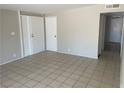Bright living room featuring a tile floor and neutral walls providing a flexible space at 1901 Belmont St, North Las Vegas, NV 89030