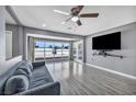 Inviting living room with a large window, ceiling fan, and comfortable sofa at 2009 Los Altos St, Las Vegas, NV 89102