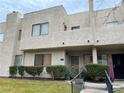 Two-story stucco condo building with welcoming entry at 2638 Aracatuba Ave, Las Vegas, NV 89121