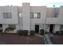 Two story stucco townhouse with parking and surrounding buildings at 2686 Ruthe Duarte Ave, Las Vegas, NV 89121