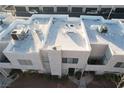 White flat roof tops of townhouses with AC units and parking at 2686 Ruthe Duarte Ave, Las Vegas, NV 89121