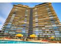 Regency Towers high-rise building with pool and patio area at 3111 Bel Air Dr # 24E, Las Vegas, NV 89109