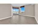 Bright bedroom with wood-look floors and access to a balcony at 322 Karen Ave # 1903, Las Vegas, NV 89109