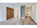 Clean hallway with wood-look floors and modern wall design at 3954 Edgemoor Way, Las Vegas, NV 89121