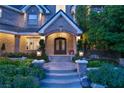 Grand entry with brick columns, arched entryway, and lush landscaping at 4386 Jerdon Ct, Las Vegas, NV 89129