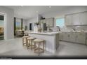 Modern kitchen with an island, white countertops, and gray cabinets at 4714 Tindra Ave # Lot 15, Las Vegas, NV 89121