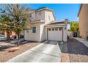 Two story house with attached garage and desert landscaping at 4924 Conglobate St, Las Vegas, NV 89122