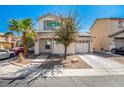 Two story house with attached garage and desert landscaping at 4924 Conglobate St, Las Vegas, NV 89122