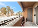 Private balcony overlooking a tree-lined community at 5261 Mission Carmel Ln # 202, Las Vegas, NV 89107