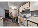 Cozy kitchen with white cabinets and a gas stove at 5261 Mission Carmel Ln # 202, Las Vegas, NV 89107