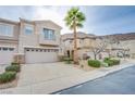 Two-story home with a two-car garage and palm tree at 723 Value Ridge Ave, Henderson, NV 89012