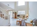 Open living room with high ceilings, and hardwood floors at 723 Value Ridge Ave, Henderson, NV 89012