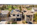 Luxury home with solar panels and a view of a golf course at 927 Via Canale Dr, Henderson, NV 89011