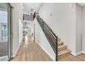 Modern staircase with sleek metal railing and light wood steps at 10273 Sierra Skye Ave, Las Vegas, NV 89166