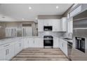 Modern kitchen with white cabinets, stainless steel appliances, and quartz countertops at 10525 Findlay Ave, Las Vegas, NV 89134