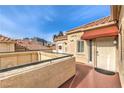 Second-floor entrance with a covered patio and city view at 230 E Flamingo Rd # 412, Las Vegas, NV 89169