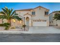 Two-story house with palm trees and a driveway at 2721 Tahiti Isle Ave, North Las Vegas, NV 89031