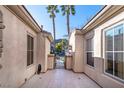 Tranquil courtyard showcasing tiled flooring, view of palm trees and neighborhood at 2794 Evening Rock St, Las Vegas, NV 89135