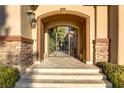 Elegant front entrance with decorative iron gate and stone detailing at 308 Bayswater Ct, Las Vegas, NV 89145