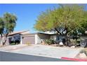 Single story home with attached garage and mature trees at 3126 Asoleado Cir, Las Vegas, NV 89121