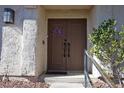 Inviting double door entry with decorative wreath at 3126 Asoleado Cir, Las Vegas, NV 89121