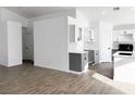 Modern kitchen with gray and white cabinets and tile floors at 3807 Aspen Creek Ave, North Las Vegas, NV 89031