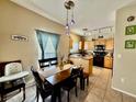 Bright dining area adjacent to kitchen, features a table with chairs at 3815 Juno Beach St # 203, Las Vegas, NV 89129