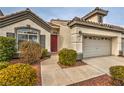 Welcoming single-story home with desert landscaping leading to the front entrance and a two-car garage at 4731 Norwegian St, Las Vegas, NV 89147