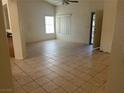 Bright living room with tile floors and access to other rooms at 551 Morning Mauve Ave, Las Vegas, NV 89183