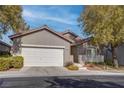 Single-story home with attached garage and mature trees at 5600 Nimes Ave, Las Vegas, NV 89141