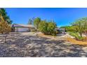 Large backyard with gravel, a shed, and a pergola at 5981 Doubletree Rd, Pahrump, NV 89061