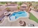 Inviting backyard pool with fire pit and patio at 6145 Sydney Bay Ct, North Las Vegas, NV 89081