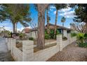 Charming single-story home with a red tile roof and a well-maintained front yard at 705 Thousand Oaks Dr, Las Vegas, NV 89123