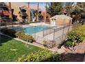 Community pool with surrounding landscaping and fencing at 8101 W Flamingo Rd # 2040, Las Vegas, NV 89147