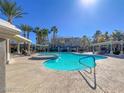 Community pool with a spa and lounge area at 950 Seven Hills Dr # 1512, Henderson, NV 89052